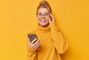 A woman holding a phone